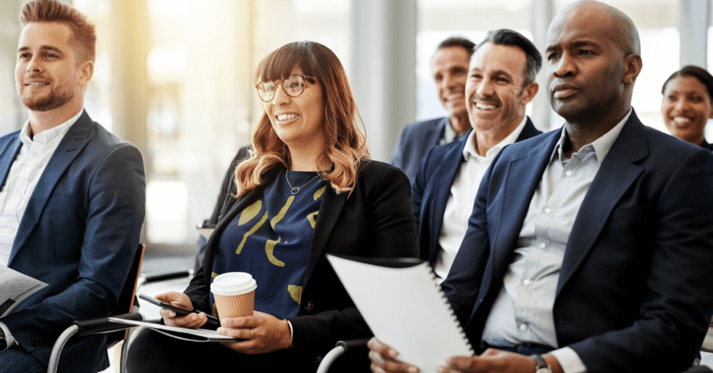 Image of seated, happy business professionals 