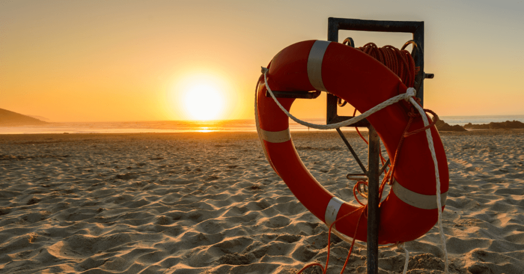 Image of life saver on a beach during sunset