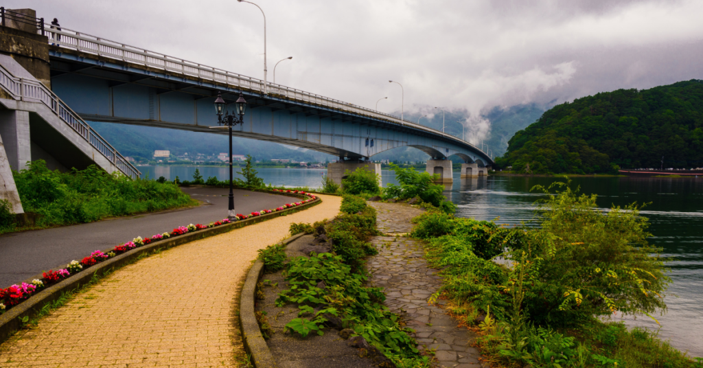 photo of a yellow brick trail against a bridge backdrop